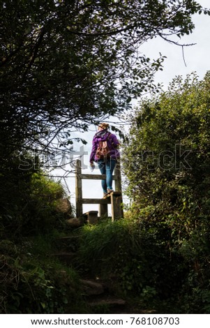 [Image: stock-photo-woman-hiking-and-going-over-...108703.jpg]