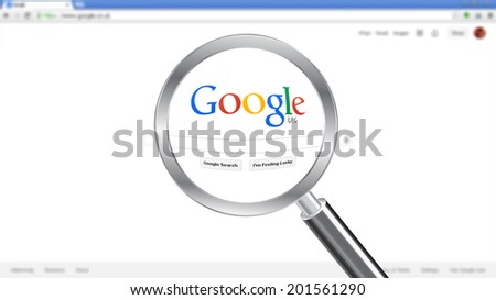 CHESHIRE - JUNE 29, 2014: Photo of Google homepage on a monitor screen through a magnifying glass.
