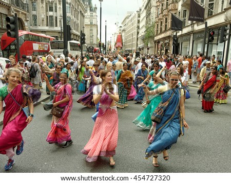 LONDON - JULY 17: The cart festival called 'Rathayatra' in London July 17, 2016. Each cart is accompanied by a chanting party, dancing in sari on the street.