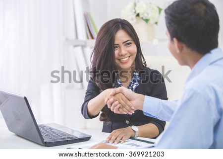 https://thumb1.shutterstock.com/display_pic_with_logo/441070/369921203/stock-photo-pretty-asian-business-woman-shaking-hands-with-businessman-in-her-office-during-meeting-369921203.jpg
