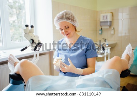 Redhaired Woman Gynecologist Examining Patient Hospital 