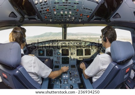 Pilots in an airplane cockpit