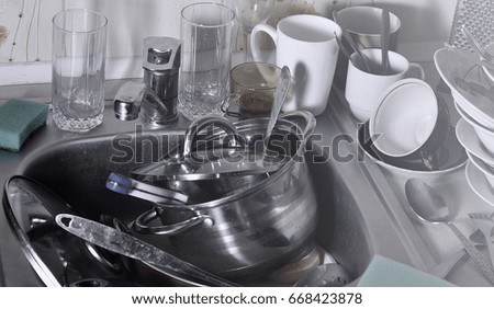 a huge pile of unwashed dishes in the kitchen sink and on the countertop a - Kitchen Sink Appliances a huge pile of unwashed dishes in the kitchen sink and on the countertop a - Kitchen Sink Appliances
