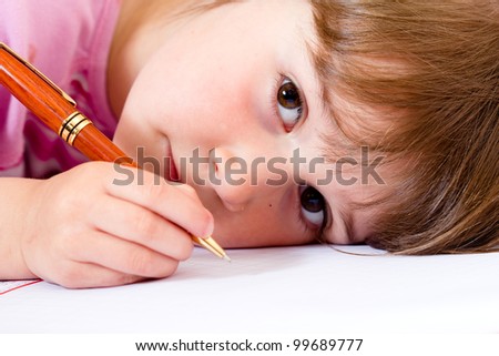 Lovely little girl learning to write