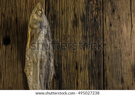 Top view of salted fish dry on old wooden tables.