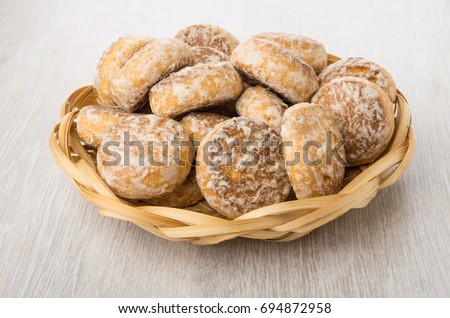 Heap Of Honey Cake In Wicker Basket On Wooden Table Heap Of Honey Cake In Wicker Basket On Wooden Table