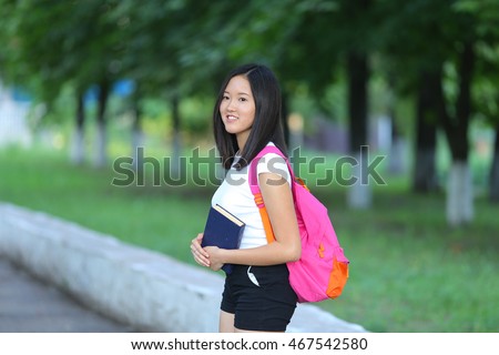 https://thumb1.shutterstock.com/display_pic_with_logo/4502014/467542580/stock-photo-girl-female-teenager-with-black-hair-in-a-bob-white-east-asian-woman-green-park-with-a-backpack-467542580.jpg