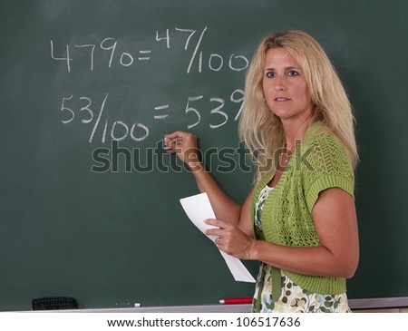 math teacher classroom chalkboard teaching fractions stock photo