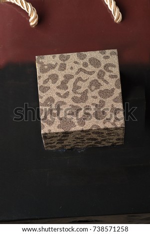 Christmas jewelry gift box on shopping bag. Holiday greeting card.Copy space.