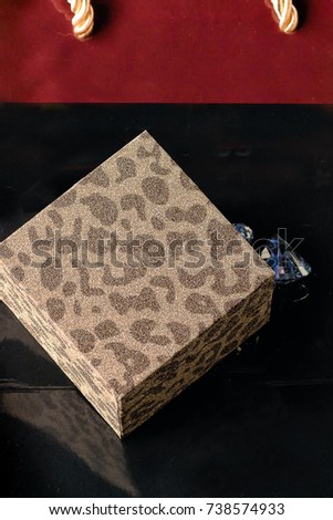 Christmas jewelry gift box on shopping bag. Holiday greeting card.Copy space.