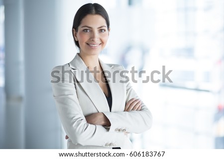 Smiling Pretty Business Woman With Arms Crossed