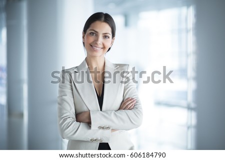 Happy Beautiful Business Woman in Office Hall