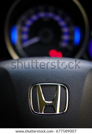 Kuala Lumpur, Malaysia - July 15, 2017 : Honda Black Steering Wheel And Silver Logo. Honda Motor Co., Ltd. is a Japanese public multinational conglomerate corporation.
