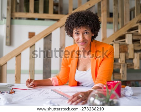 Young female engineer working in office
