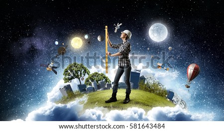 Builder woman taking measures . Mixed media