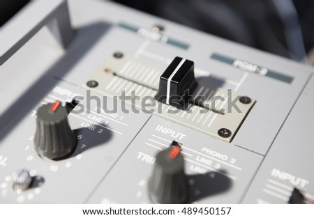 stock-photo-old-analog-dj-sound-mixer-knob-crossfader-regulator-to-mix-music-tracks-professional-audio-disc-489450157.jpg