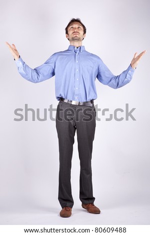 stock-photo-handsome-young-man-in-a-blue