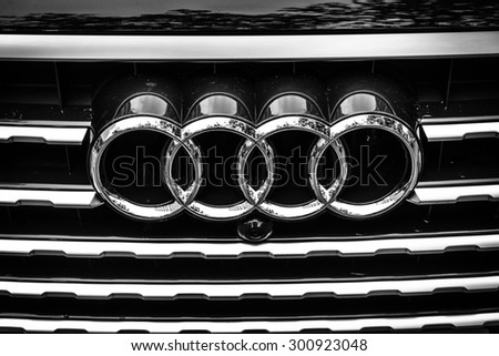 BERLIN - JUNE 14, 2015: The emblem on the front grille of a full-size luxury crossover SUV Audi Q7 3.0 TDI quattro. Black and white. The Classic Days on Kurfuerstendamm.