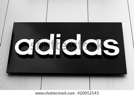 Bucharest, Romania, May 4, 2016: Adidas sign and logo. Adidas is a German multinational corporation that designs and manufactures sports shoes, clothing and accessories headquartered in Bavaria