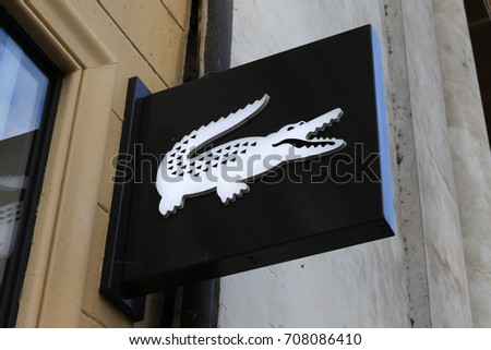 Prague, Czech Republic - August 27, 2017: Lacoste sign on a store. Lacoste is a French clothing company that sells high-end clothing, footwear, perfume, leather goods, and most famously polo shirts
