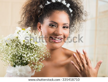 https://thumb1.shutterstock.com/display_pic_with_logo/482065/335418710/stock-photo-portrait-of-beautiful-exotic-african-american-bride-wearing-white-dress-and-holding-flower-bouquet-335418710.jpg