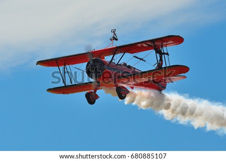 Memorial Airshow, 24th of June 2017, Roudnice, Czech Republic. Bucker Jungmeister in flight, smoke effect
