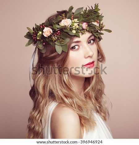 https://thumb1.shutterstock.com/display_pic_with_logo/493354/396946924/stock-photo-beautiful-blonde-woman-with-flower-wreath-on-her-head-beauty-girl-with-flowers-hairstyle-perfect-396946924.jpg