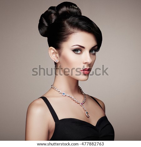 https://thumb1.shutterstock.com/display_pic_with_logo/493354/477882763/stock-photo-fashion-portrait-of-young-beautiful-woman-with-jewelry-and-elegant-hairstyle-brunette-girl-477882763.jpg
