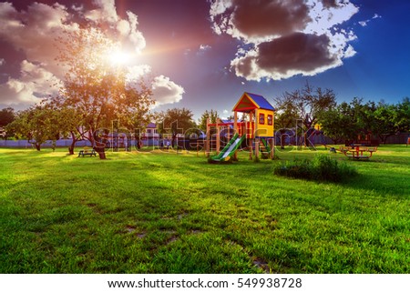 playground of children's near a house. vintage photo