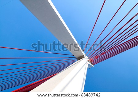Suspension bridge with cables reaching to the deck of the bridge from the columns