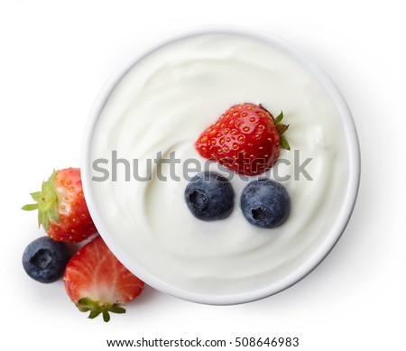 Bowl of greek yogurt and fresh berries isolated on white background from top view