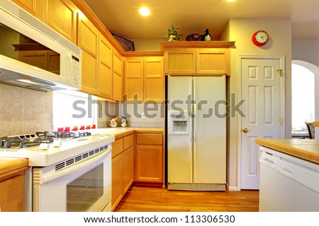 White Kitchen Appliances With Wood Cabinets kitchen yellow wood cabinets white appliances stock photo White Kitchen Appliances With Wood Cabinets kitchen yellow wood cabinets white appliances stock photo