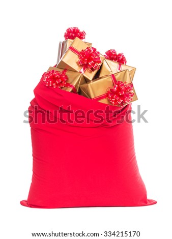Red big Santa Christmas sack full of golden wrapped gift boxes with bows isolated on a white background