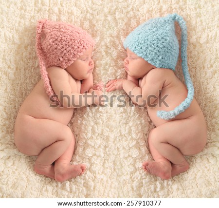 Newborn twin babies, boy and girl