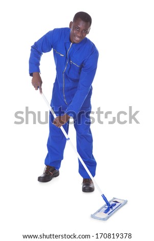 Young Man In Blue Suit Cleaning The Floor Over White Background - stock ...