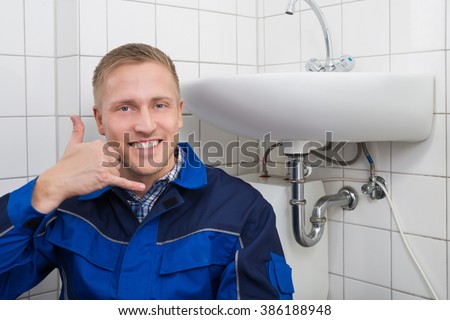 Calling Plumber Stock Images, Royalty-Free Images 