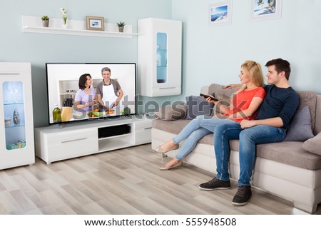 Living Room With Tv And People couple watching tv stock images, royalty-free images & vectors Living Room With Tv And People couple watching tv stock images, royalty-free images & vectors