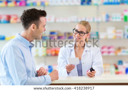 Pharmacist and client at pharmacy