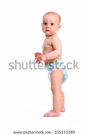 Cute Smiling Baby Sits On The Bed. Happy Naked Baby 