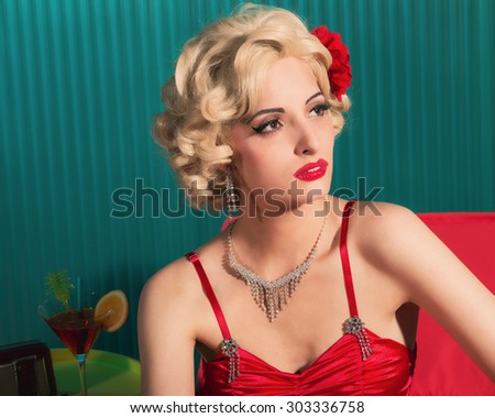 https://thumb1.shutterstock.com/display_pic_with_logo/521287/303336758/stock-photo-close-up-thoughtful-blond-young-woman-in-an-elegant-sexy-red-fashion-looking-into-the-distance-303336758.jpg