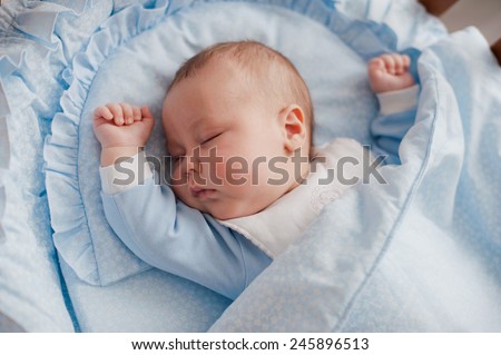 baby sleeps with a cradle