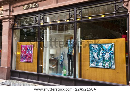 MANCHESTER, UK - SEPTEMBER 18, 2014: Window display of the Hermes French luxury goods boutique in the city centre.