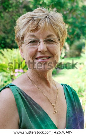 https://thumb1.shutterstock.com/display_pic_with_logo/53073/53073,1260606997,7/stock-photo-portrait-of-an-attractive-mature-woman-in-her-s-42670489.jpg