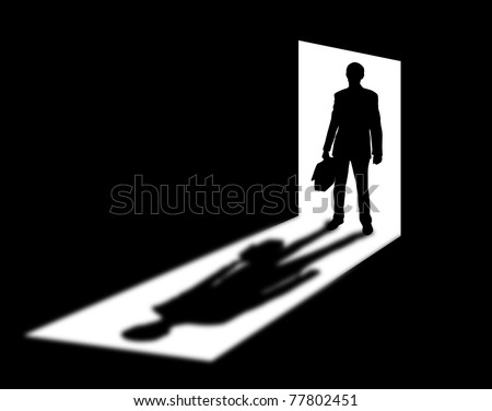 Silhouette of coming businessman in doorway with shadow - stock photo