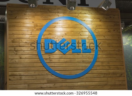 KIEV, UKRAINE - OCTOBER 11, 2015: Dell logo on a wooden base illuminated by searchlights on company booth during CEE 2015, largest electronics trade show of Ukraine in ExpoPlaza Exhibition Center.