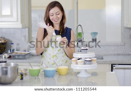 Woman Decorating Cupcakes cupcake decorating stock photos, royalty-free images & vectors Woman Decorating Cupcakes cupcake decorating stock photos, royalty-free images & vectors