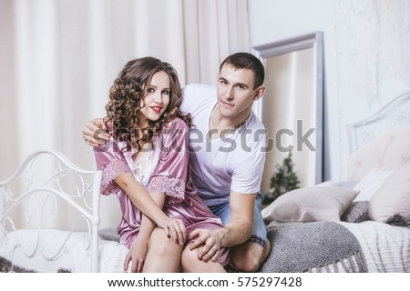 https://thumb1.shutterstock.com/display_pic_with_logo/545221/575297428/stock-photo-couple-man-and-woman-young-and-beautiful-home-in-the-bedroom-on-a-romantic-date-together-in-love-575297428.jpg