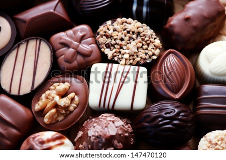 various chocolates as a background - sweet food - stock photo