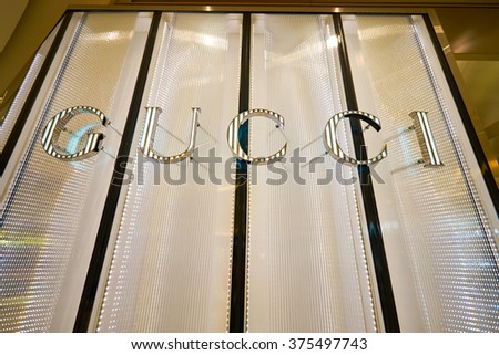 HONG KONG - JANUARY 27, 2016: Gucci logo on the wall at Elements Shopping Mall. Gucci is a luxury Italian fashion and leather goods brand, part of the Gucci Group