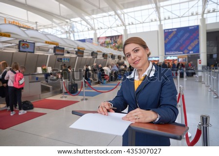 NEW YORK - APRIL 06, 2016: portrait of woman at check-in area of Lufthasa. Lufthansa, is the largest German airline and, when combined with its subsidiaries, also the largest airline in Europe.